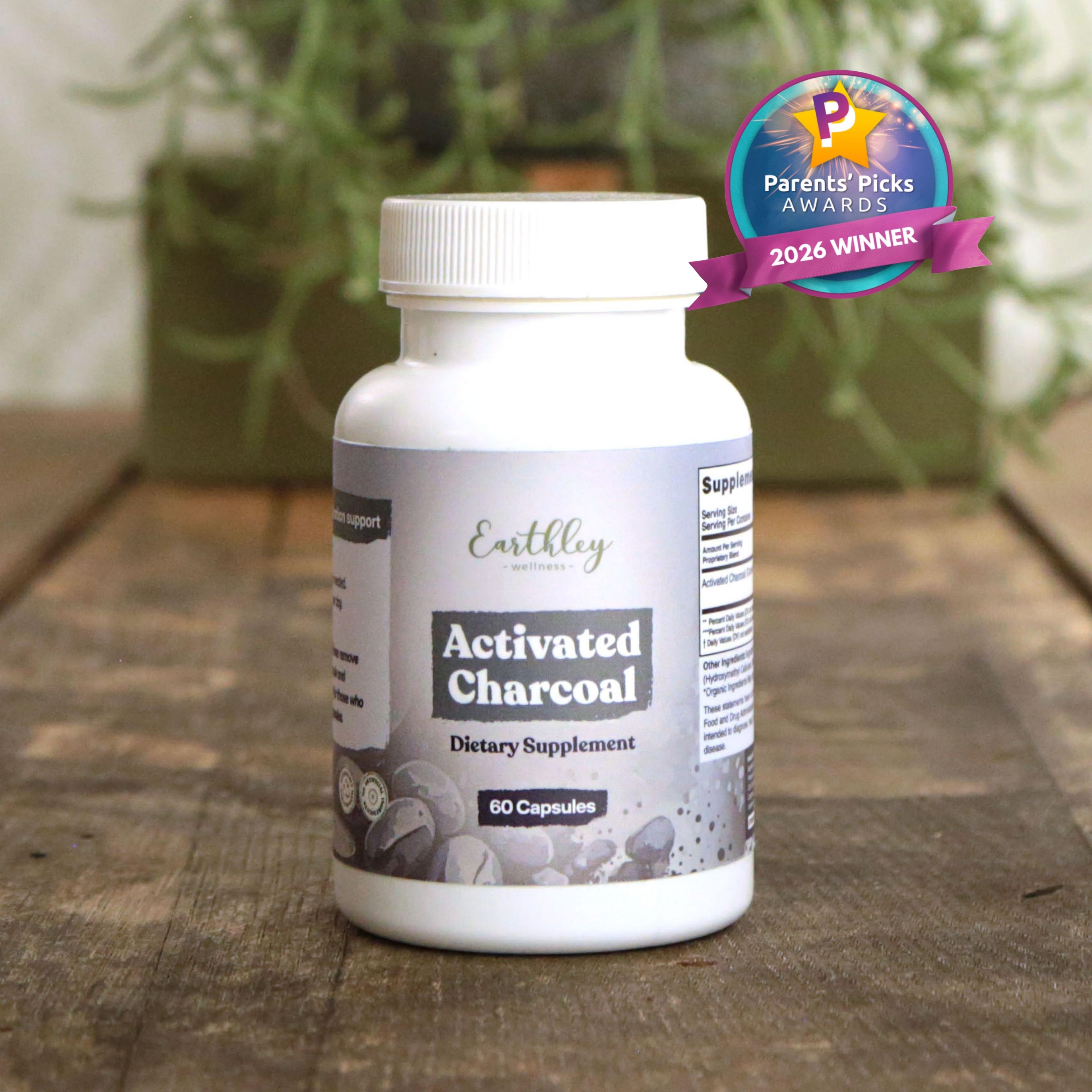 Earthley Activated Charcoal supplement bottle with Parents' Picks Awards 2026 Winner badge on wooden surface