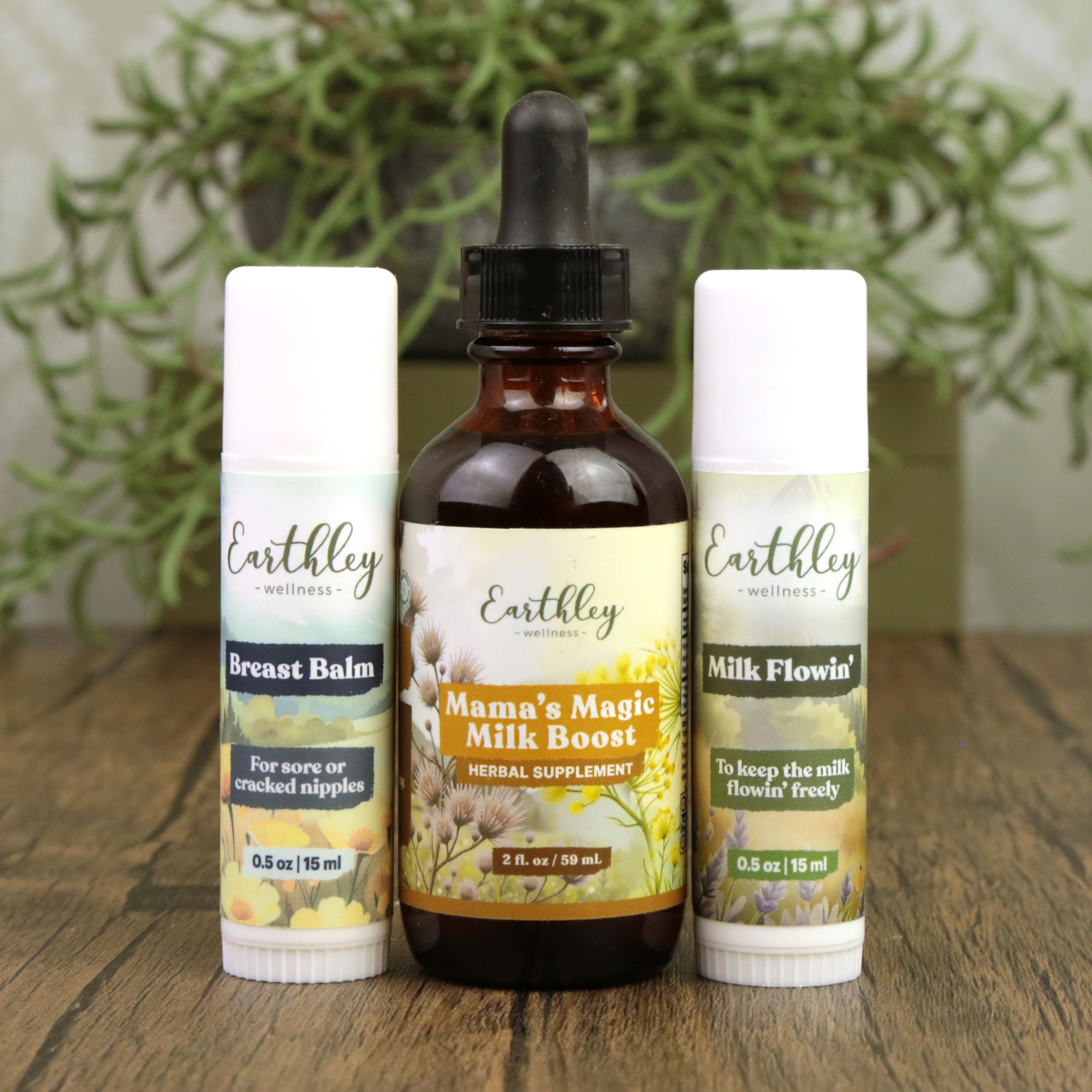 Three Earthley Wellness breastfeeding products: Breast Balm, Mama's Magic Milk Boost tincture, and Milk Flowin' balm on wood surface