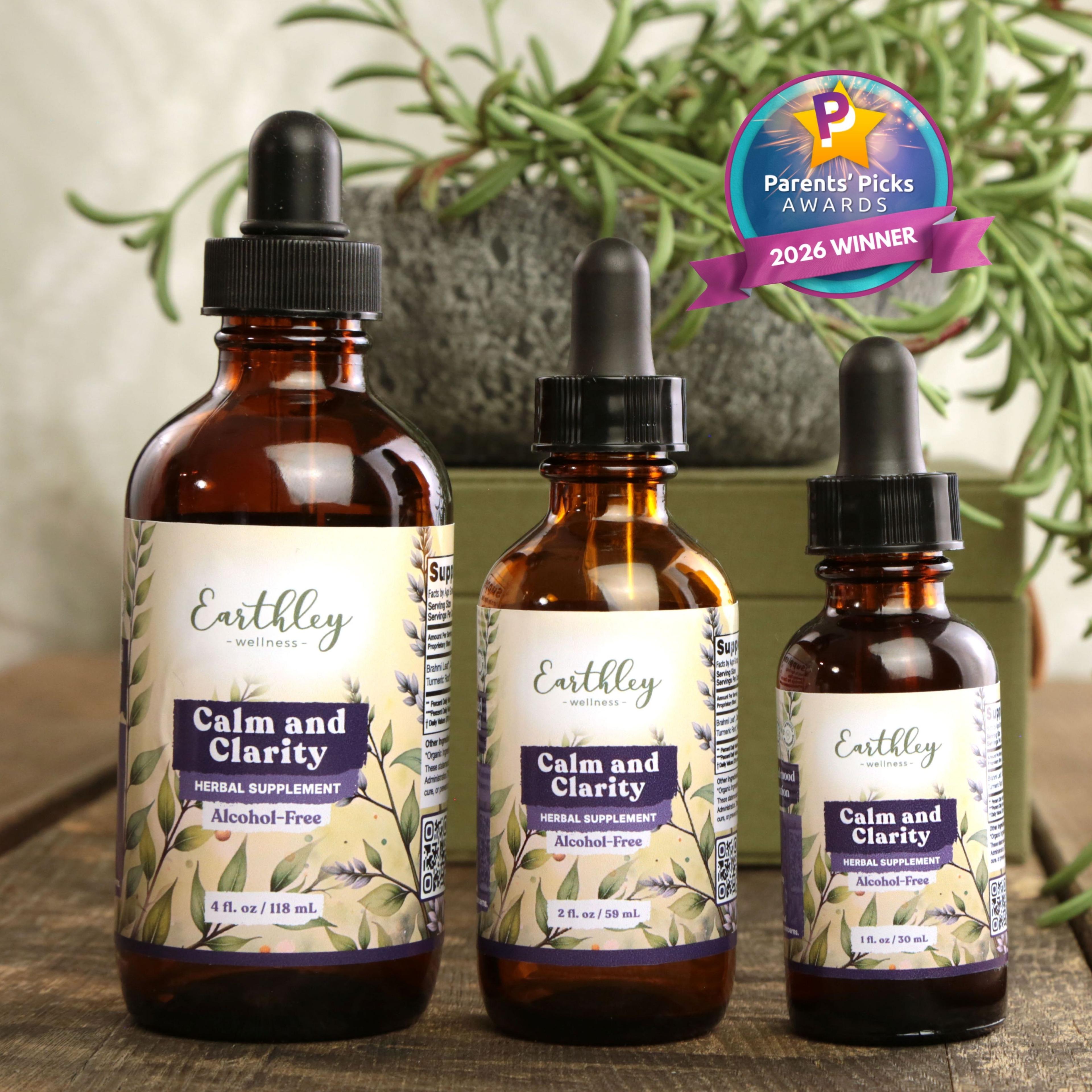 Three amber glass bottles of Earthley Calm and Clarity herbal tinctures in different sizes with Parents' Picks Awards 2026 Winner badge