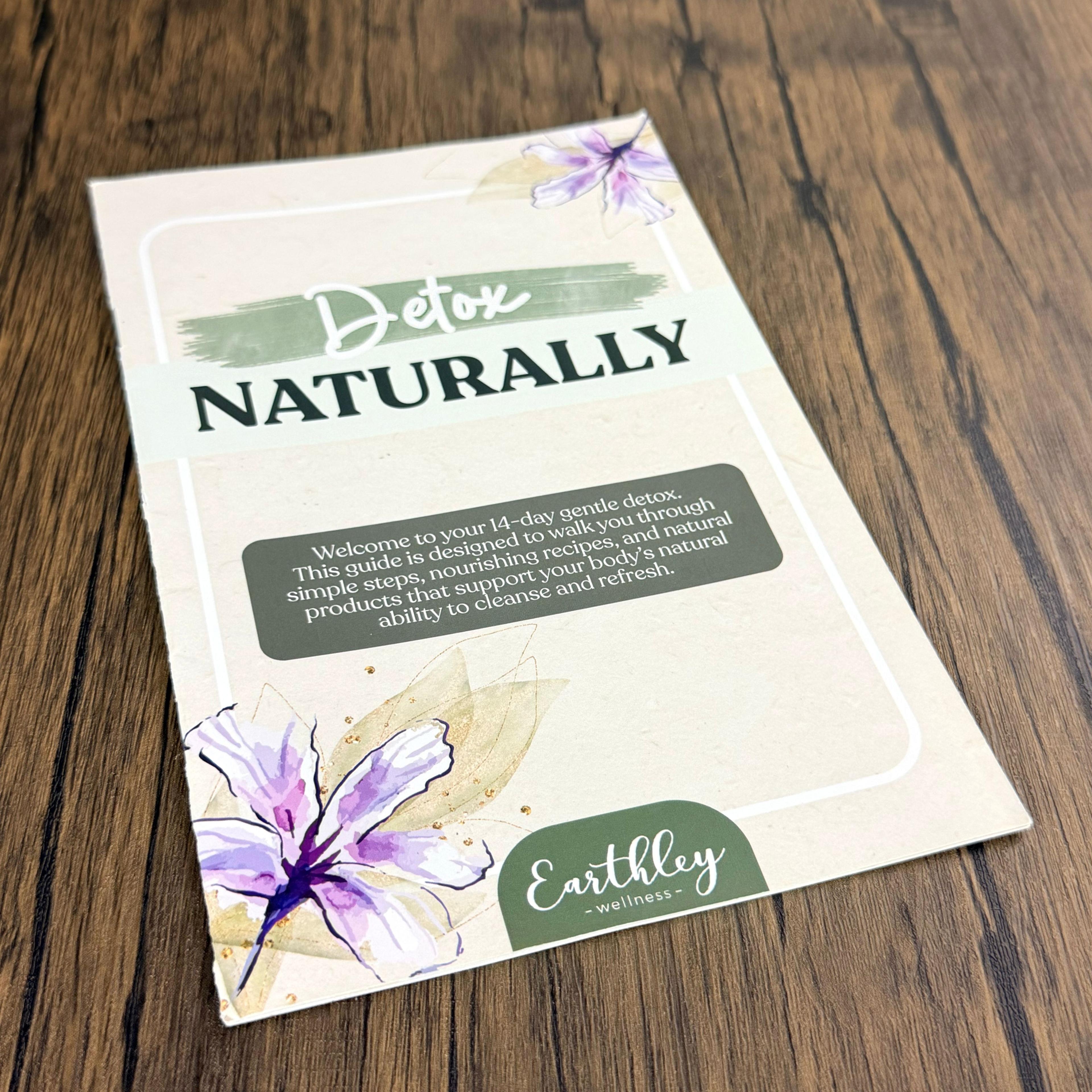 Earthley Wellness "Detox Naturally" 14-day gentle detox guide booklet with purple floral design