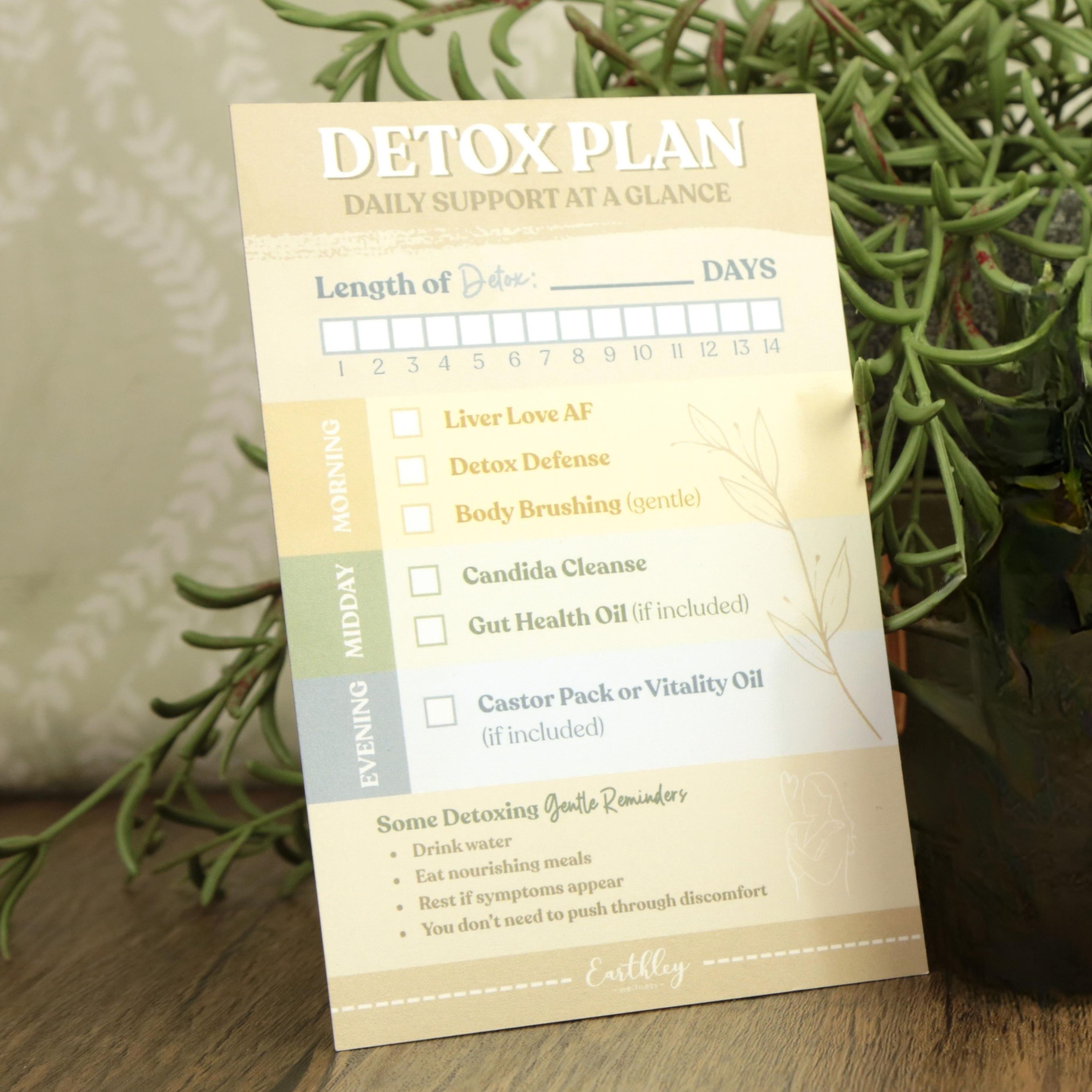 Detox plan tracking card with 14-day calendar and product checklist including Liver Love AF, Detox Defense, and Body Brushing