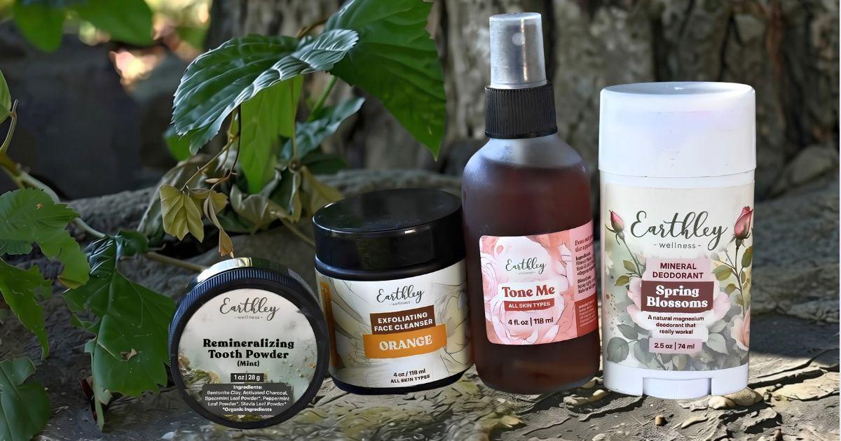 Four Earthley Wellness natural products: mint tooth powder, orange face cleanser, toner spray, and Spring Blossoms deodorant.