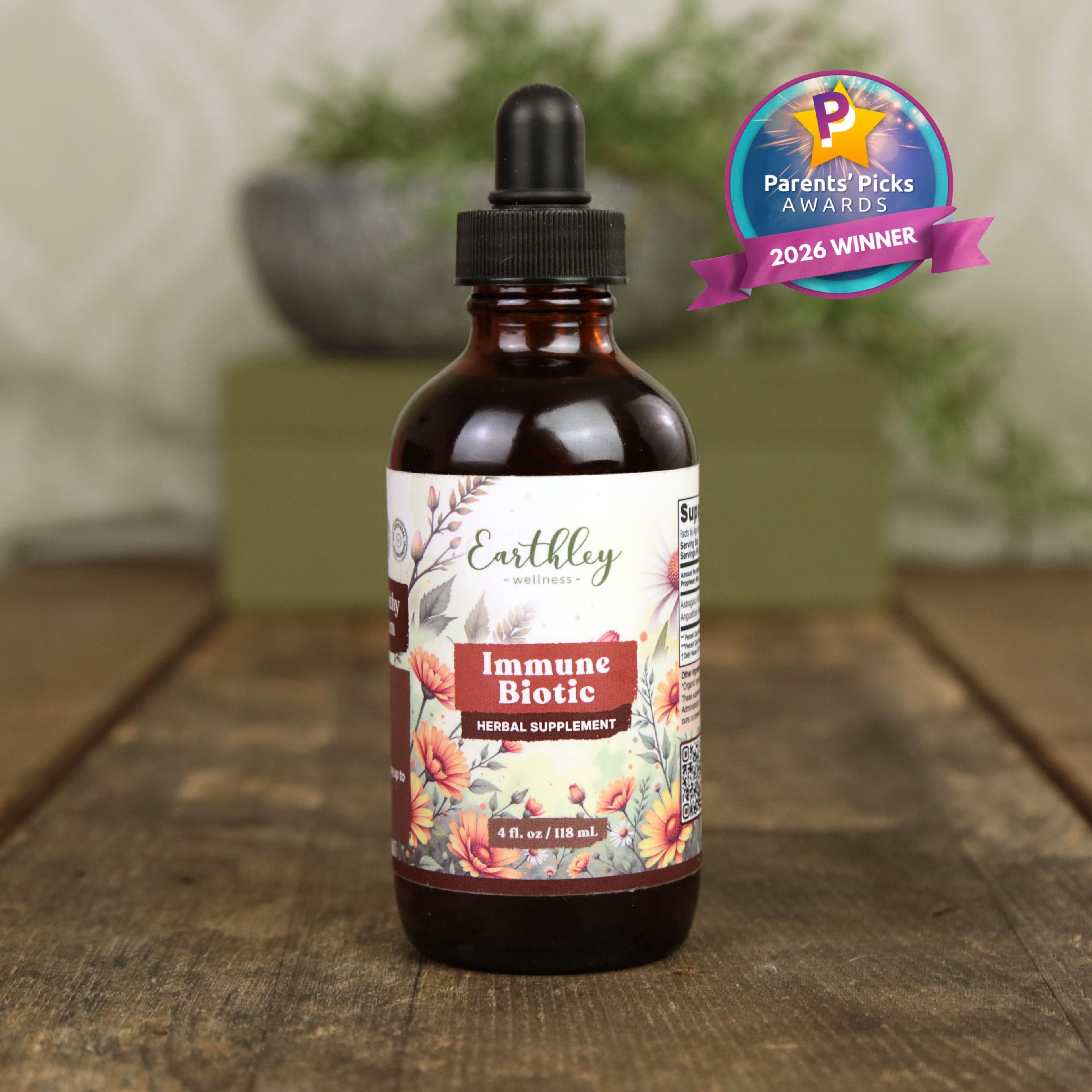 Earthley Immune Biotic herbal supplement bottle with dropper, featuring floral label design and Parents' Picks 2026 Winner badge