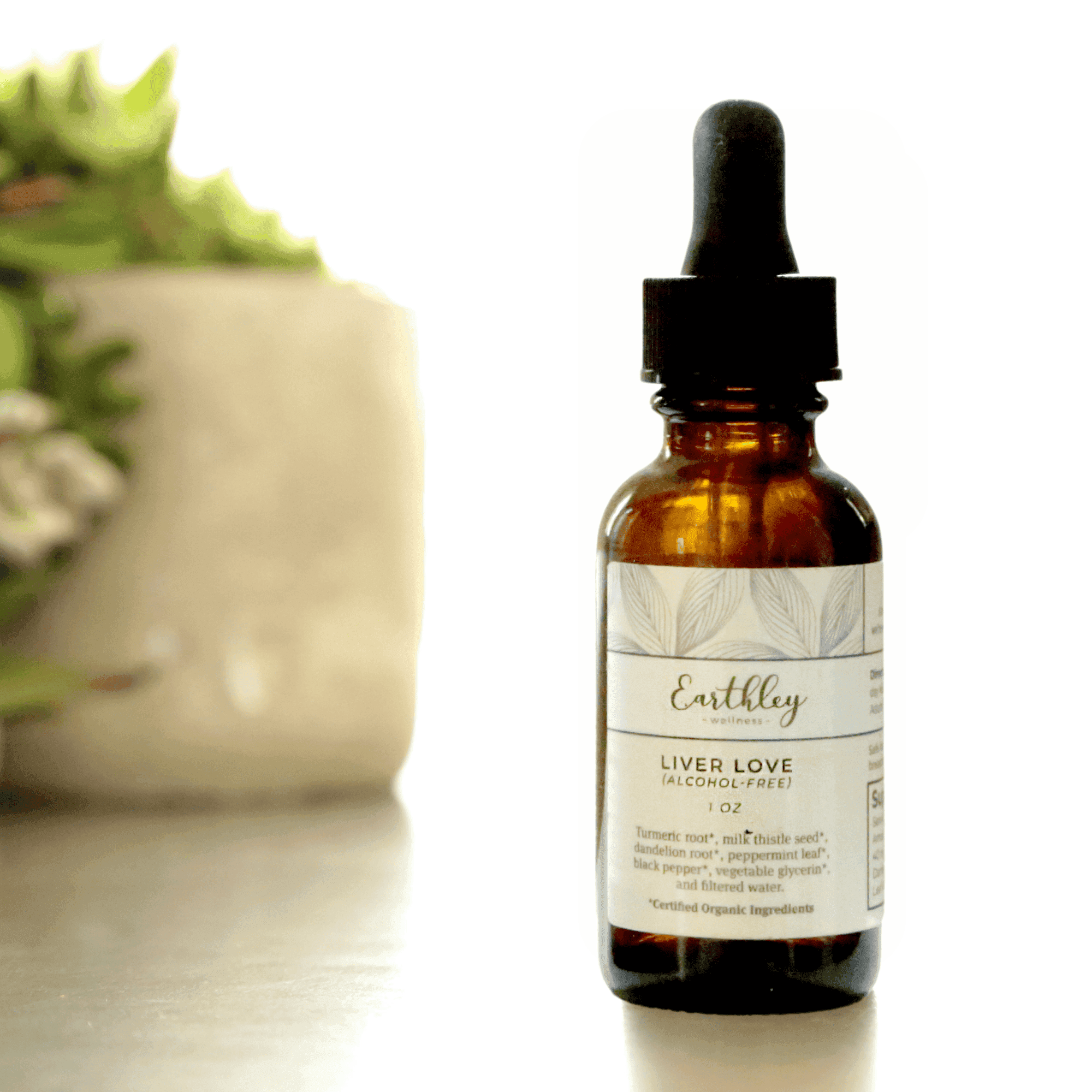 Earthley Liver Love tincture bottle with sage green leaf pattern label