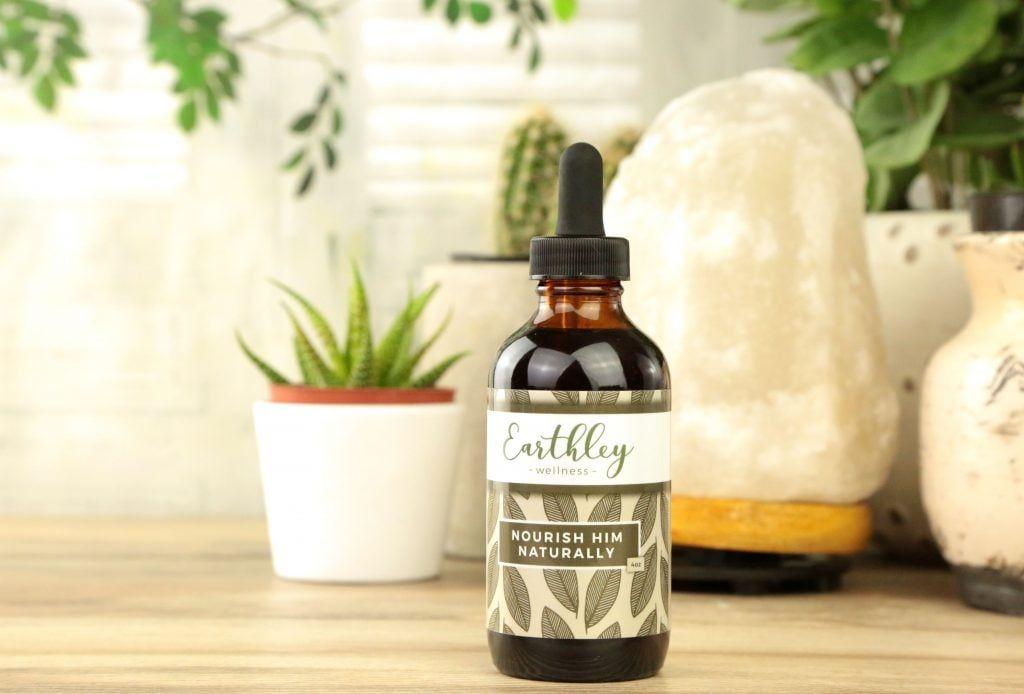 Nourish Him herbal extract in amber dropper bottle with blue leaf label