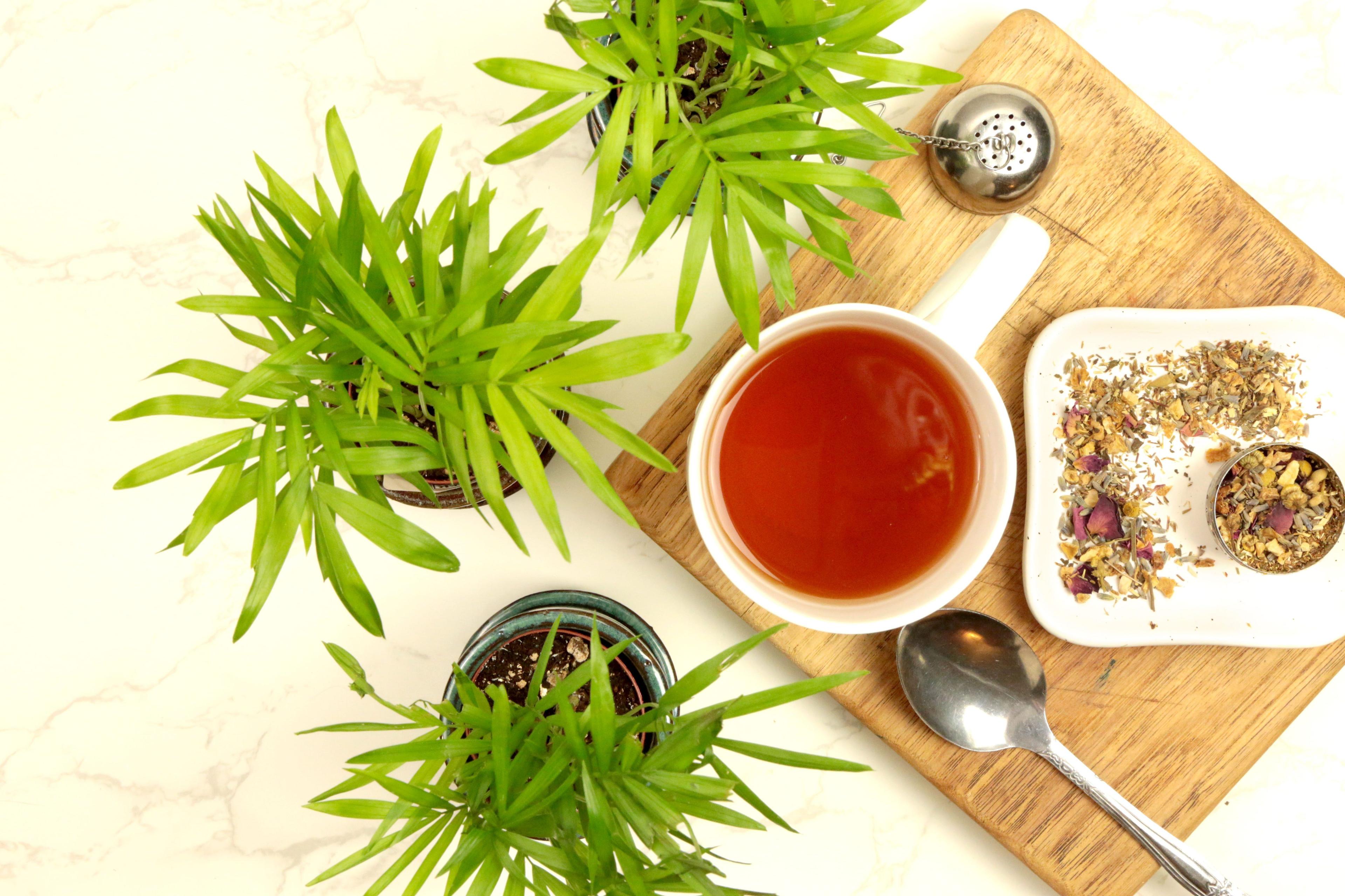 Earthley Relax and Unwind Tea herbal tea blend for calming relaxation in amber jar