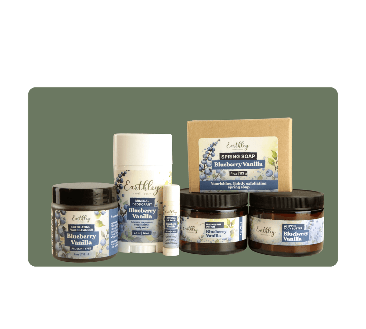 Earthley Blueberry Vanilla skincare collection featuring exfoliating cleanser, deodorant, soap, magnesium lotion, and body butter